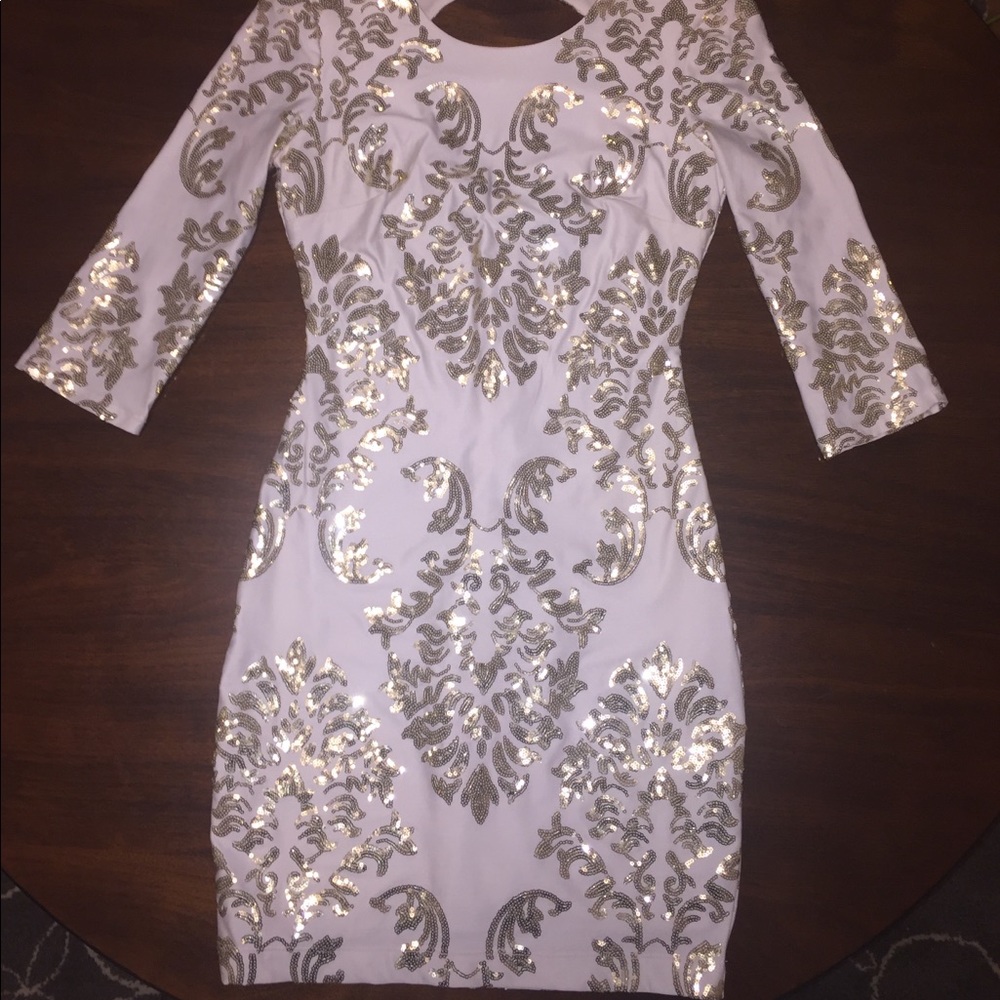 Knee length white and gold homecoming dress.